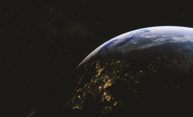 Looking down at Earth from outer space with city lights