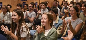Group image of a crowd clapping hands
