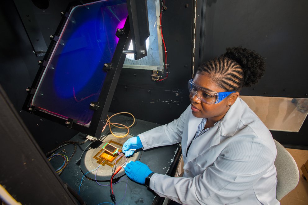 Image of Dr. Lyndsey McMillon-Brown at NASA’s Glenn Research Center studying solar cells made from a material called perovskite.